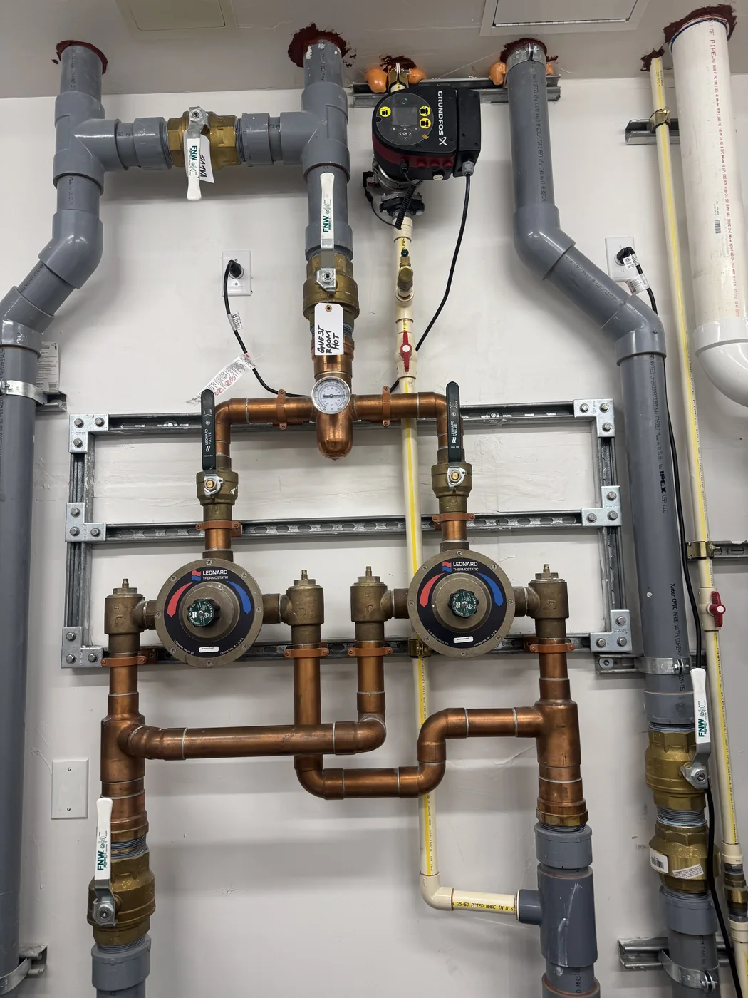 Large commercial mechanical room with water heating equipment