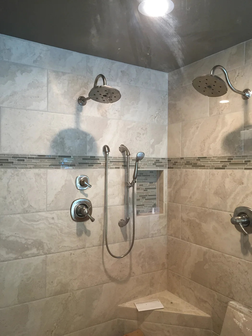 Residential tiled shower with modern plumbing fixtures